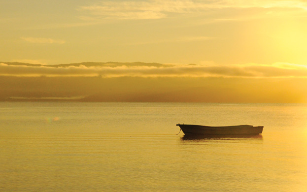 Sunset-Osa-Peninsula-Caminos-de-Osa-calm-waters-boat Ecotourism