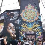 Urban-Art-Safari-Mural-by-Maskien-from-Costa-Rica,-Sinless-from-Panama-and-Humones-and-Frase-from-México.-Photo-by-María-Charles