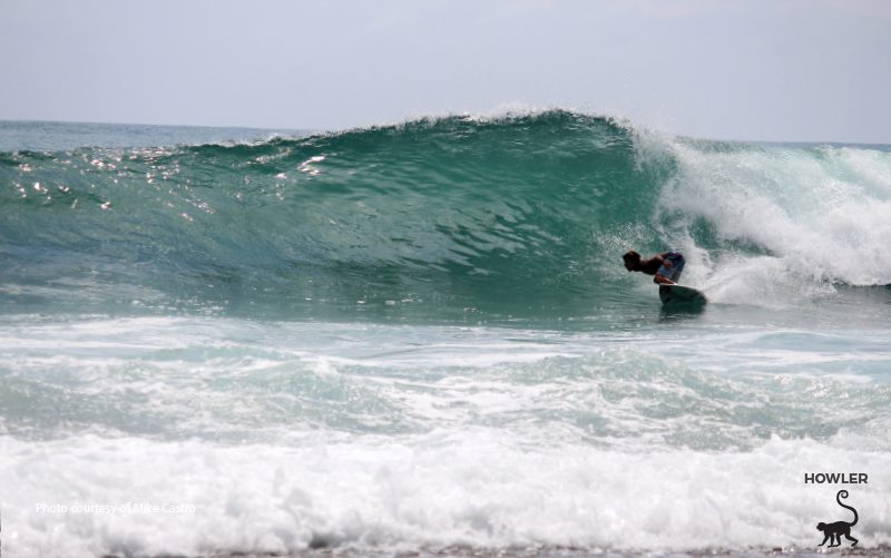 under a barrel of a wave surfing in costa rica
