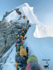 line of climbers on mount everest